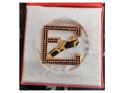 ZLATÁ TRETRA / Golden Spike. Upomínkové logo ve zlaté barvě se 118 červenými kameny (český granát?).